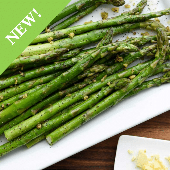 white rectangle plate of cooked and seasoned asparagus