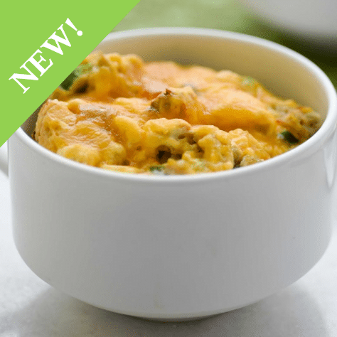 egg omelet mixture in a large white mug with handle
