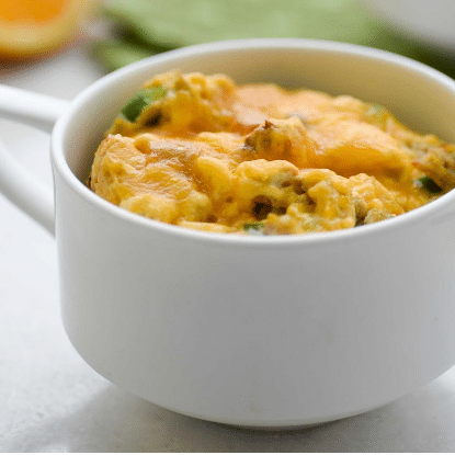 egg omelet mixture in a large white mug with handle