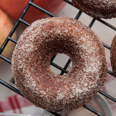 brown sugared donut cooling on rack