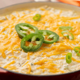 buffalo chicken dip with sliced jalapenos on top