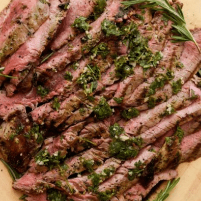 grilled flank steak with green garnish