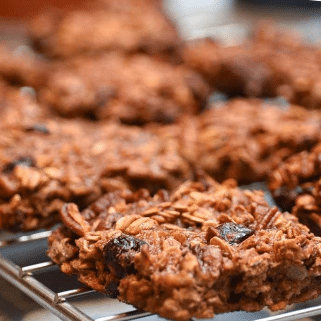 square flat oatmeal bars cooling on a rack