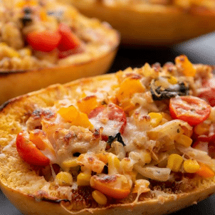 spaghetti squash stuffed with vegetable mixture and cheese